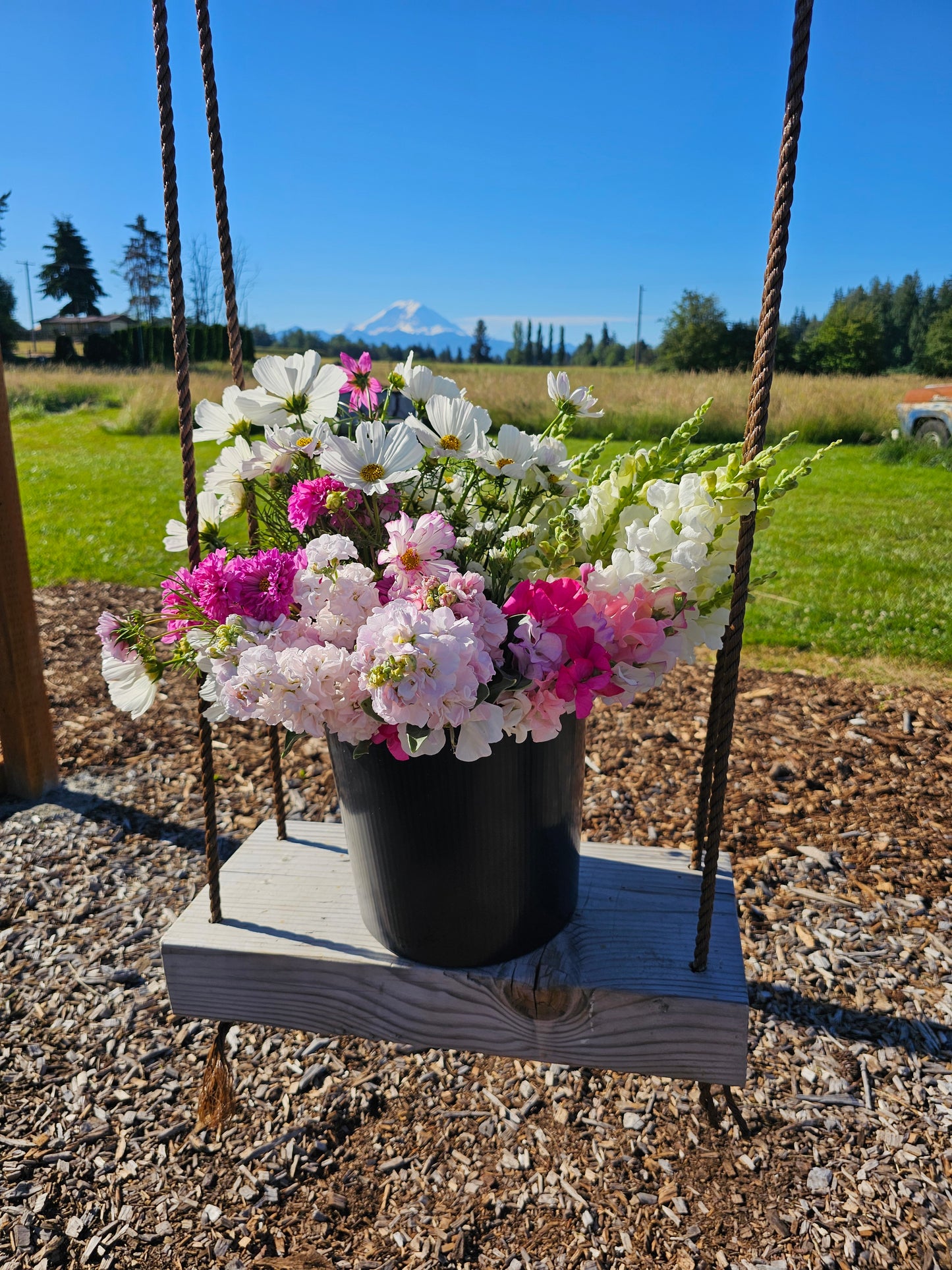 DIY flower bucket with farm-fresh seasonal blooms for weddings and events